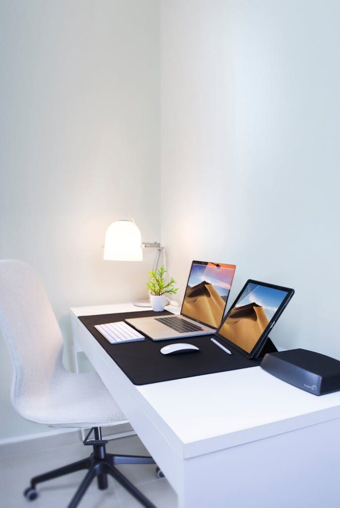 pexels photo 2528118 Stylish home office desk with dual screens and minimalist decor. Perfect for remote work and productivity.